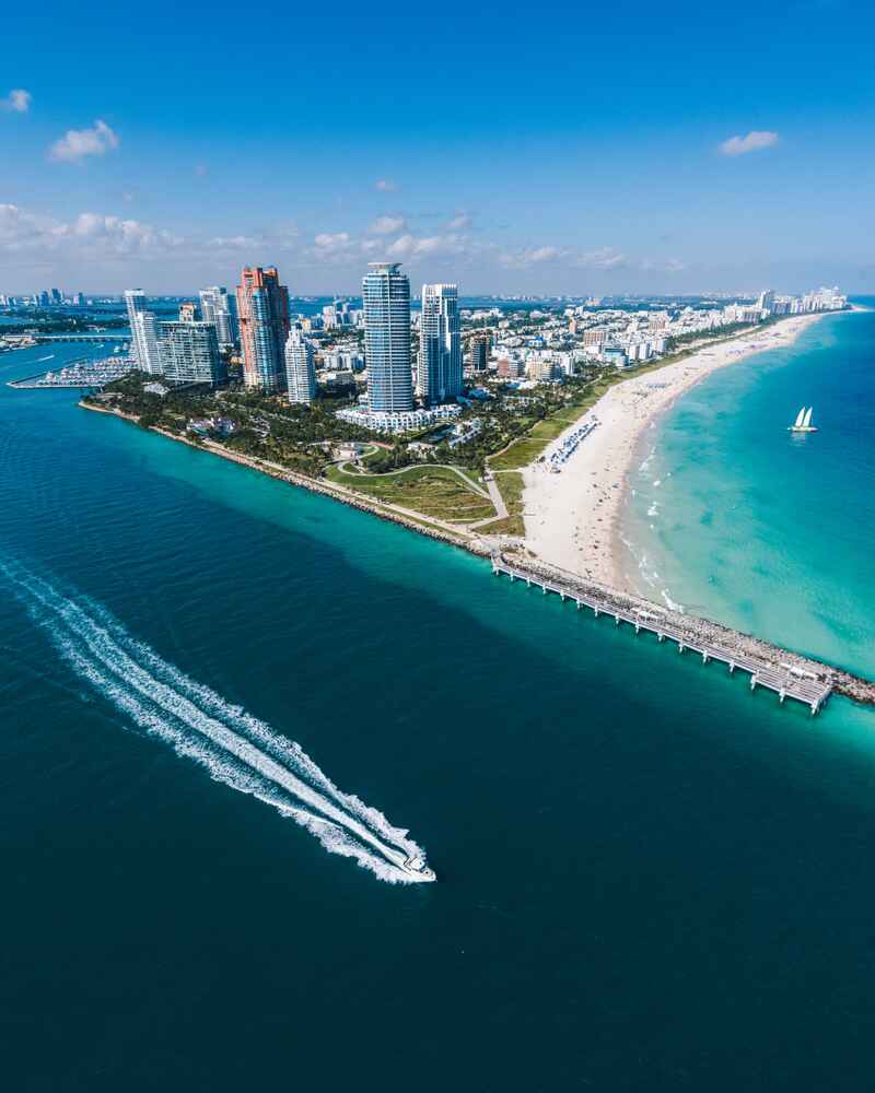 Aerial view of Miami Beach with a boat in the water