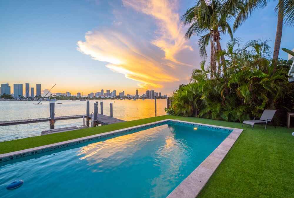 Backyard of house overlooking the pool and intracoastal